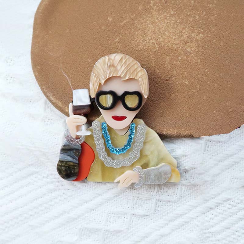 Brown quirky cool lady brooch holding a wine glass | NueShiny